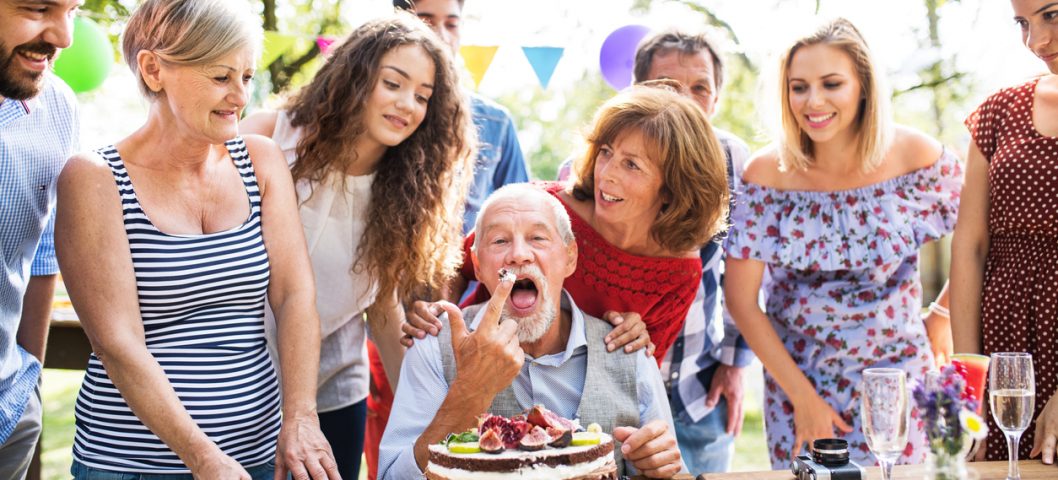 Family celebration outside in the backyard. Big garden party for a birthday.