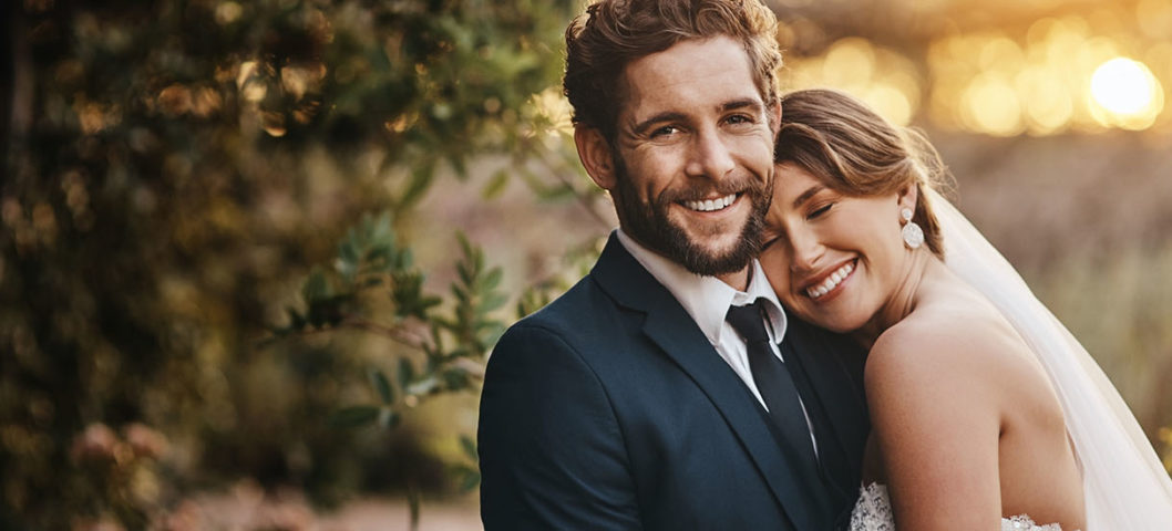 Bride-and-groom-posing-for-a-photo-on-their-wedding-day