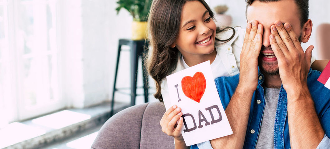 Daughter-handing-her-dad-the-best-Fathers-Day-gifts