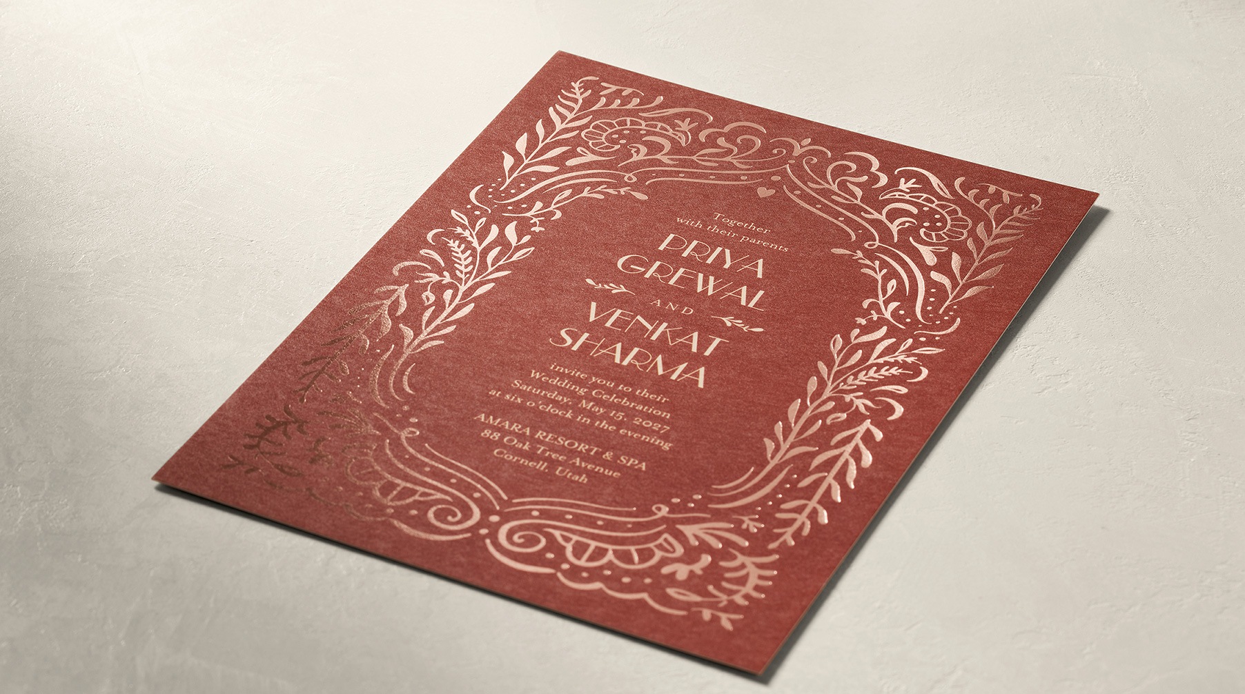 Elegant, ornate wedding invitation with example wording