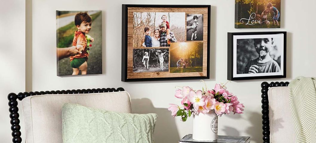 Gallery wall hanging above chairs.