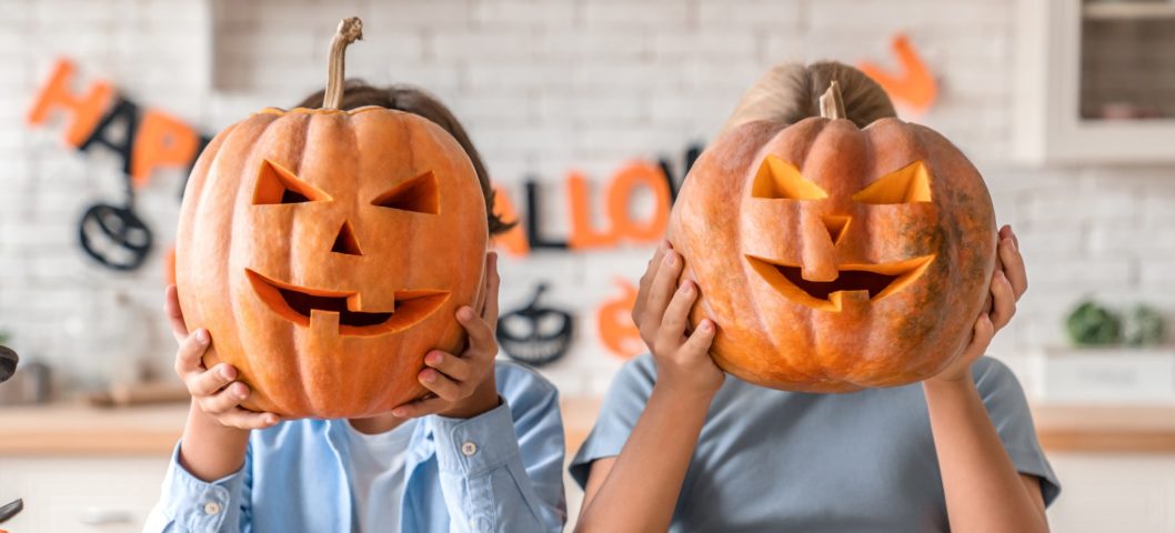 Children carving pumpkins for Halloween